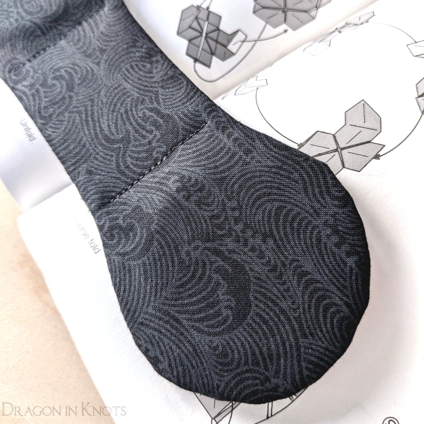 Black Ocean Waves Book Weight - Dragon in Knots