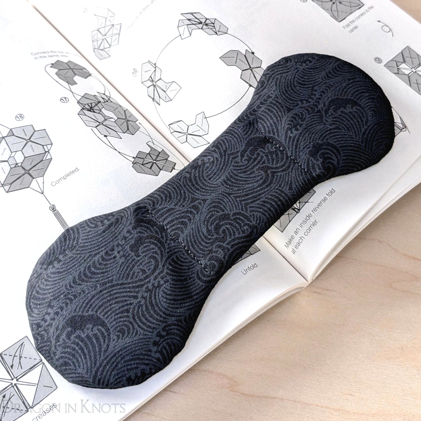 Black Ocean Waves Book Weight - Dragon in Knots